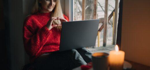 Woman using online dating app on laptop. Valentines Day During The Coronavirus Outbreak. Love at